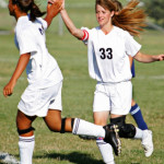Soccer Players High Fiving Soccer Players High Fiving